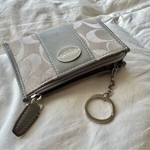 Coach Silver and Gray Logo Zipper Wallet
Leather and Material